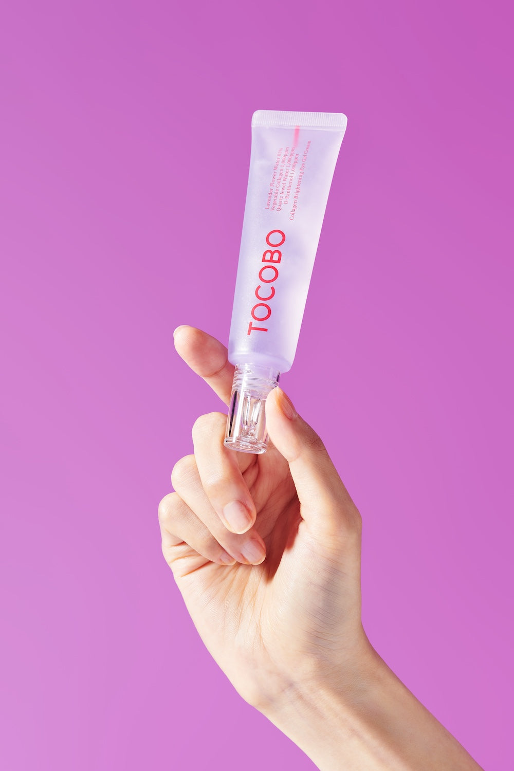 Eye cream tube next to face cream for routine flatlay