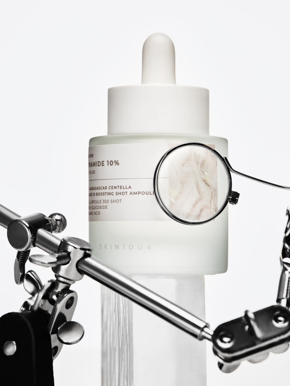 SKIN1004 niacinamide ampoule next to toner bottle