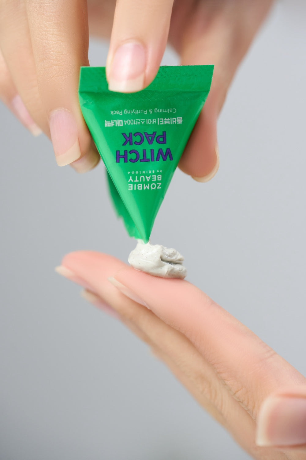 Witch pack sachet held for size reference