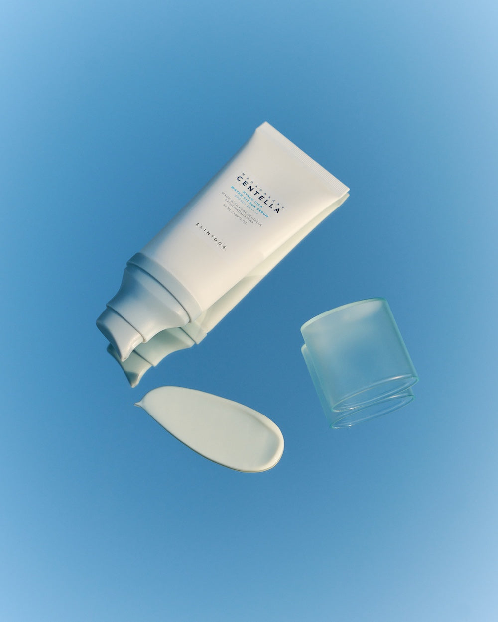 Sun serum texture stretched between fingers