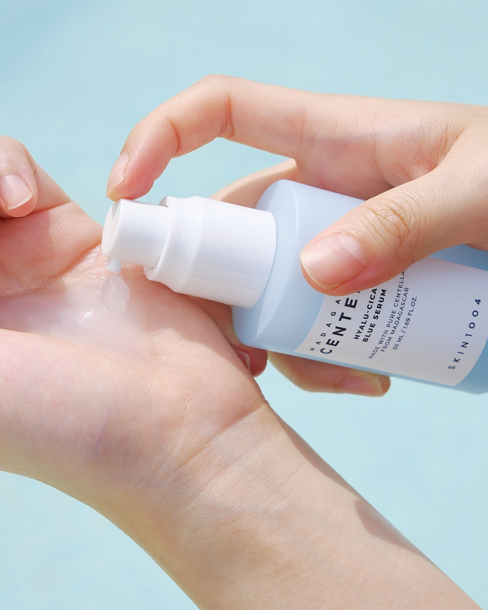 Serum pump dispensing liquid onto palm
