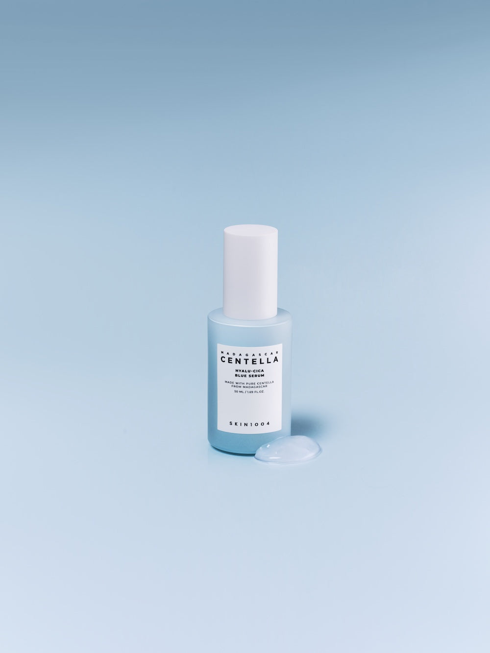 Blue serum bottle cap removed showing pump