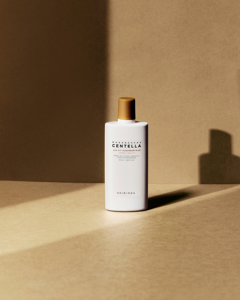 Suncream bottle and box together on table