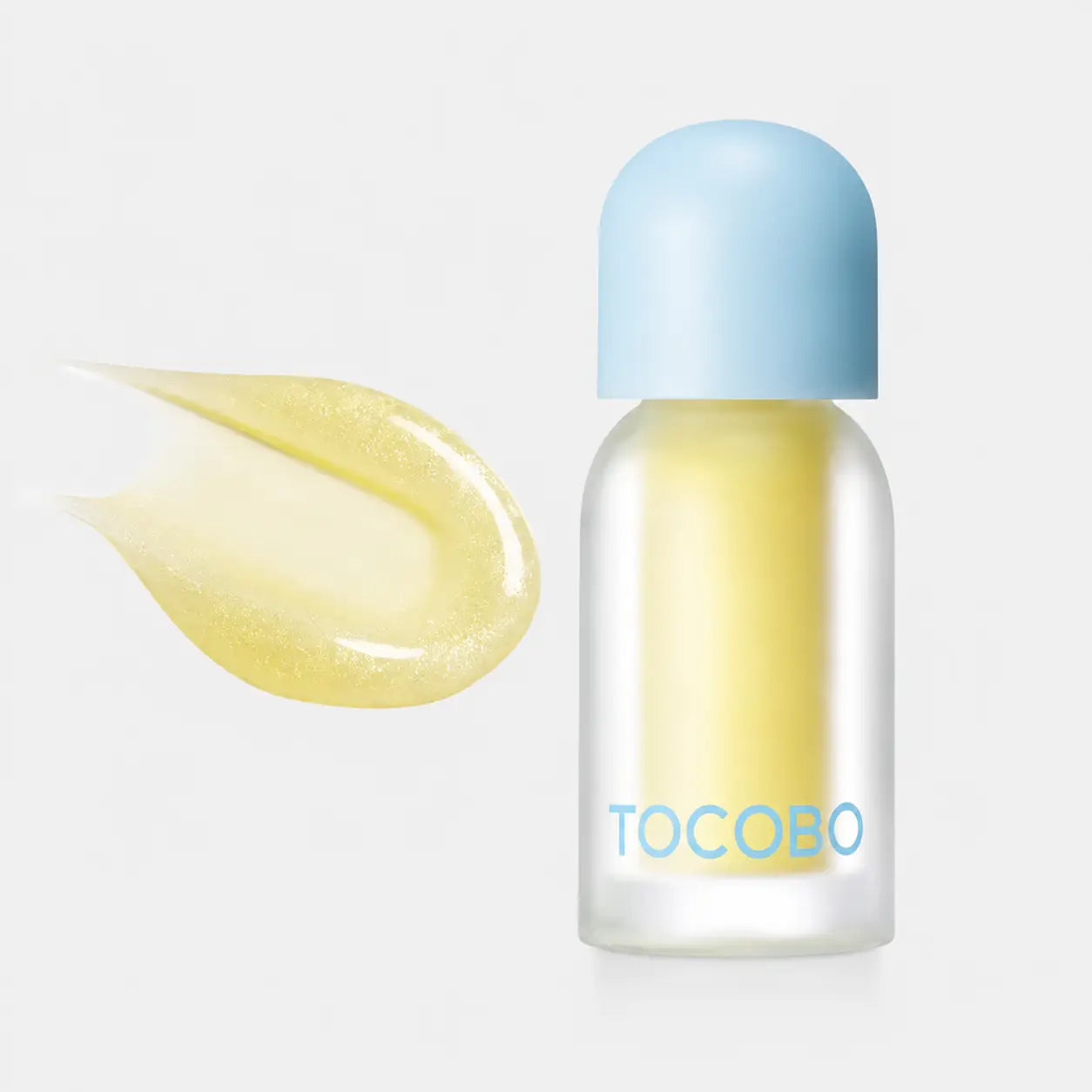 Tocobo Juicy Berry Plumping Lip Oil held between fingers