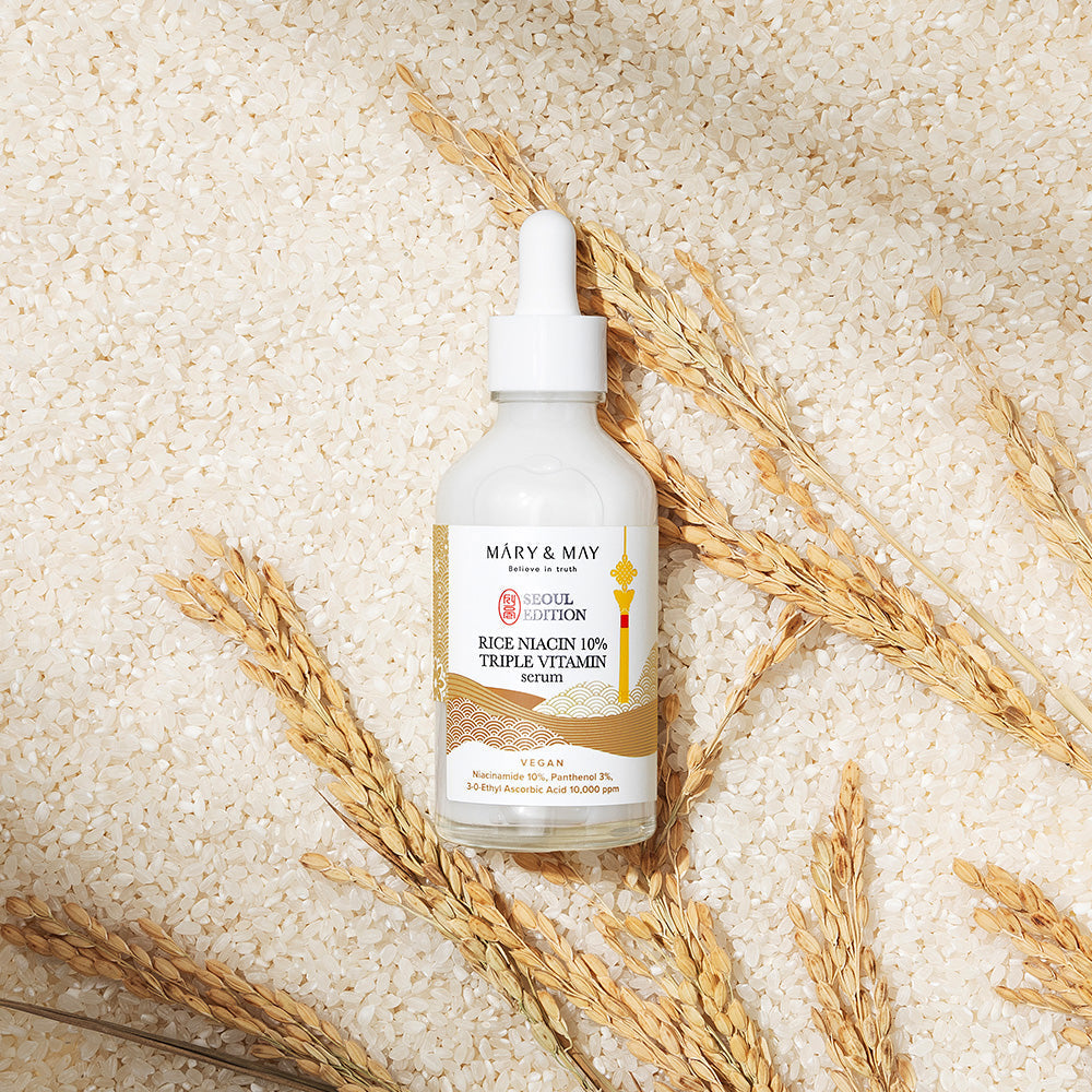 Model applying rice niacin serum during morning routine