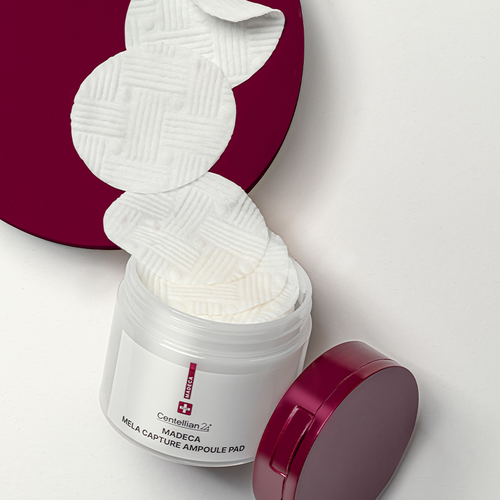 Centellian24 Madeca Mela Capture Ampoule Pad next to Madeca Cream jar