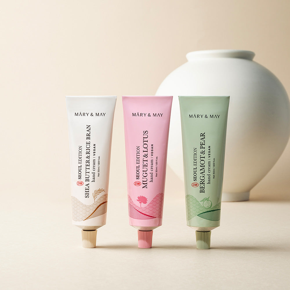 Model applying hand cream during daily routine