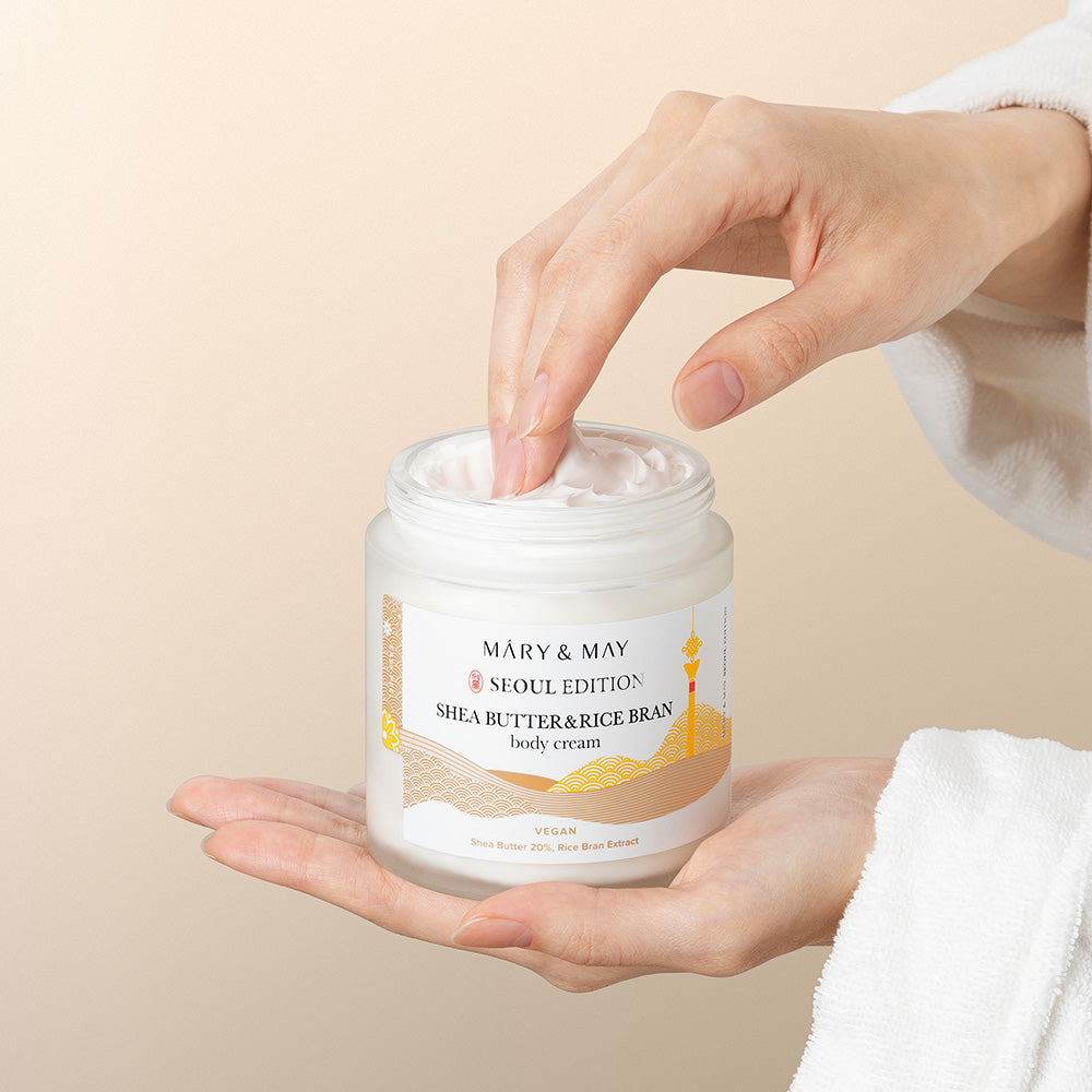 Close up of body cream texture on fingertip