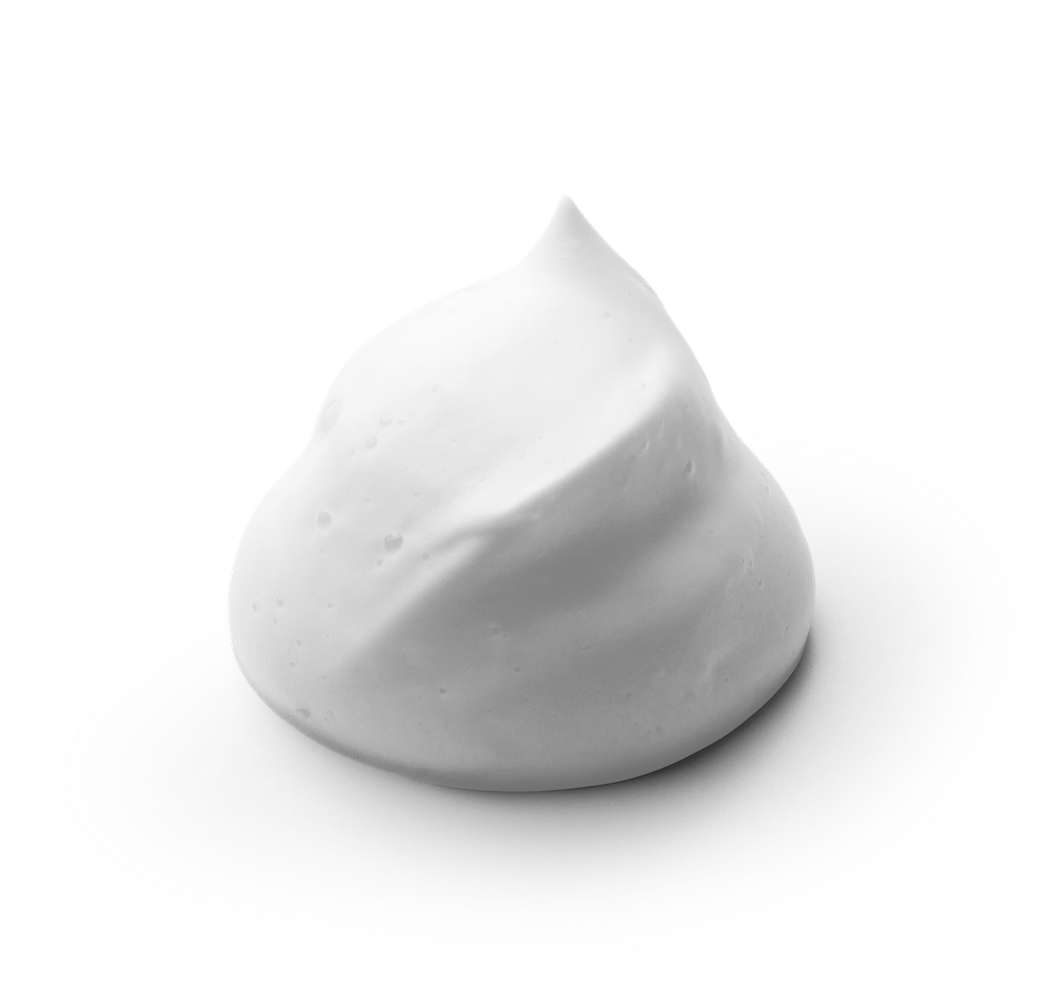 Cleansing foam being lathered between hands