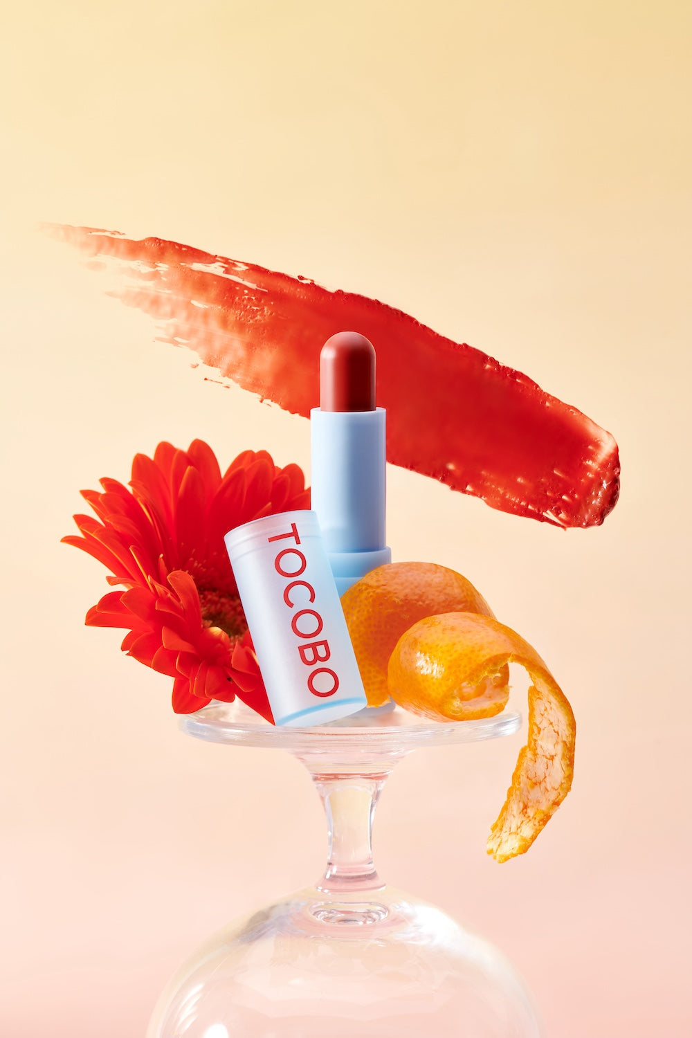 Lip balm tube standing upright on shelf