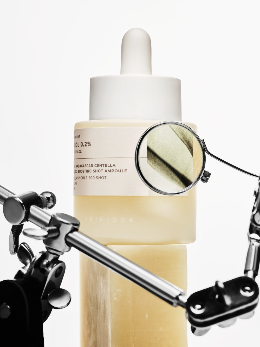 SKIN1004 retinol ampoule held for size reference