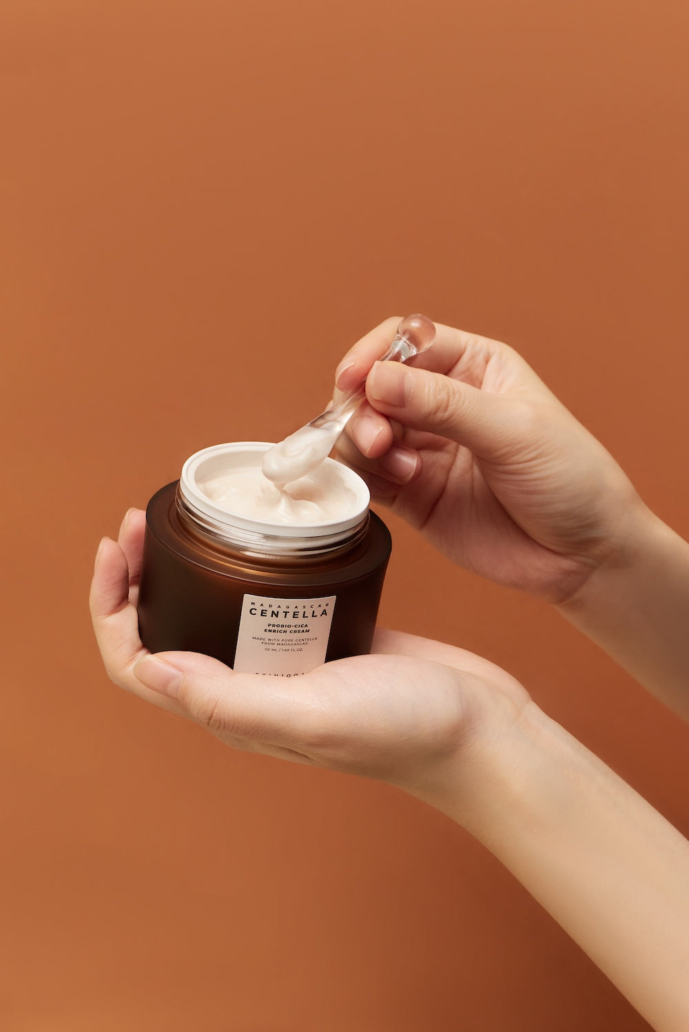 Close-up of SKIN1004 logo on enrich cream jar