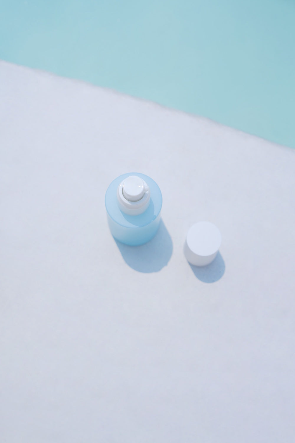Close-up of SKIN1004 logo on blue serum bottle
