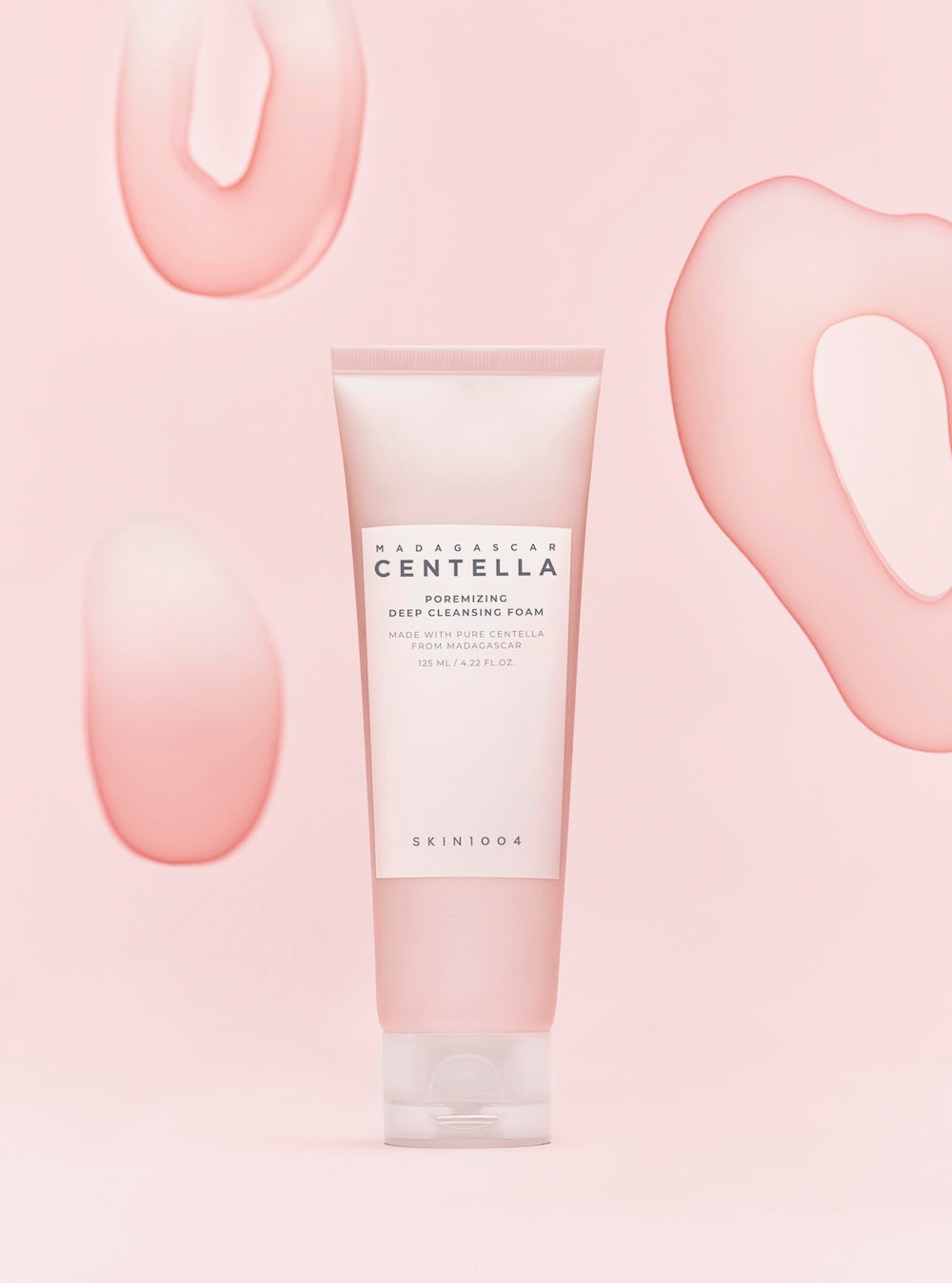 The foam cleanser being massaged onto damp skin