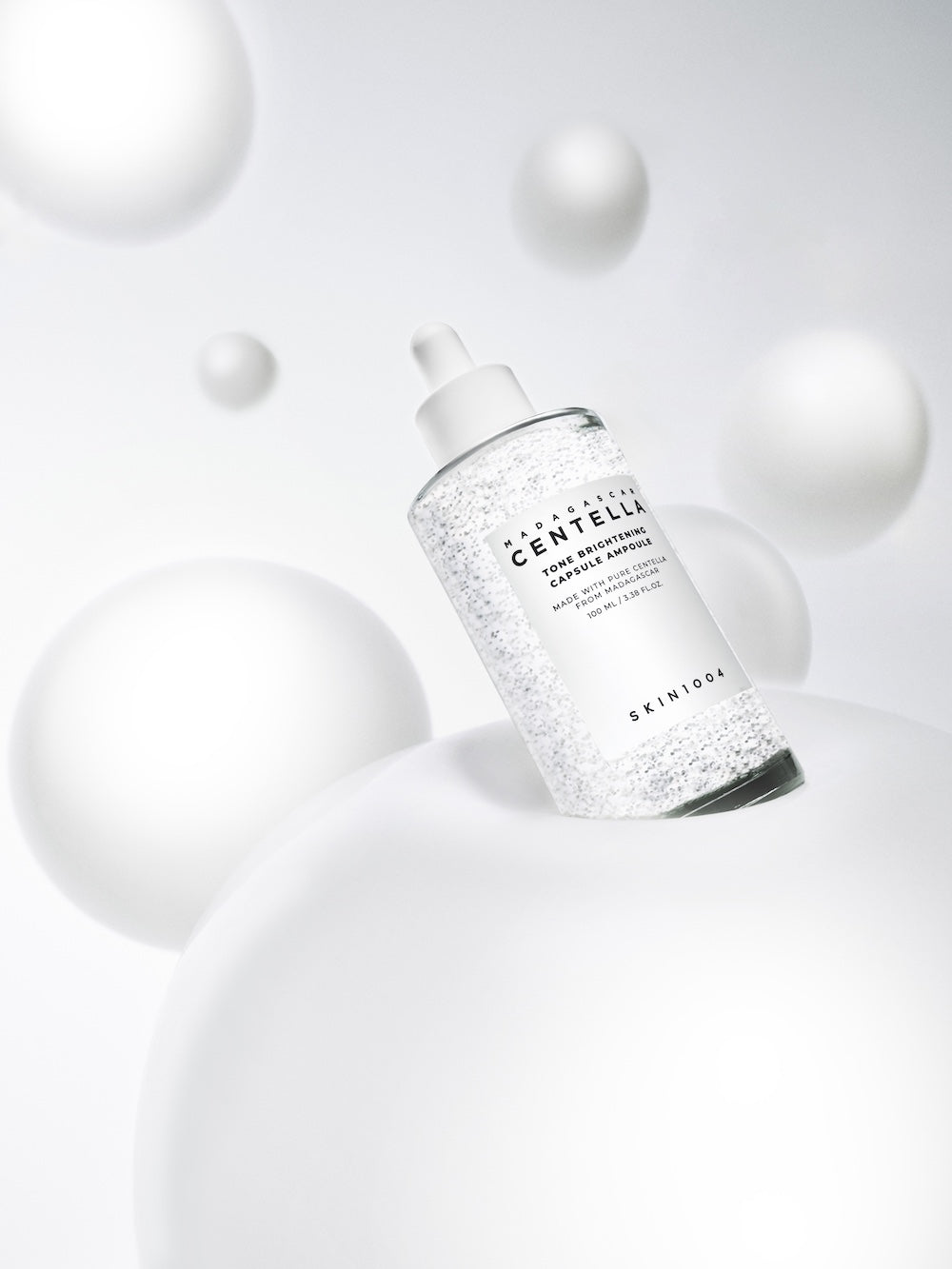 Close-up of SKIN1004 logo on ampoule bottle