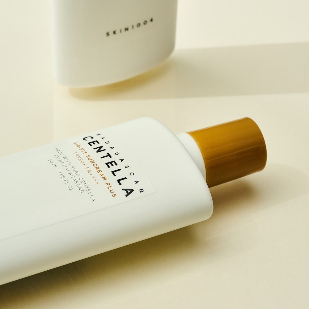 Suncream bottle displayed on light background