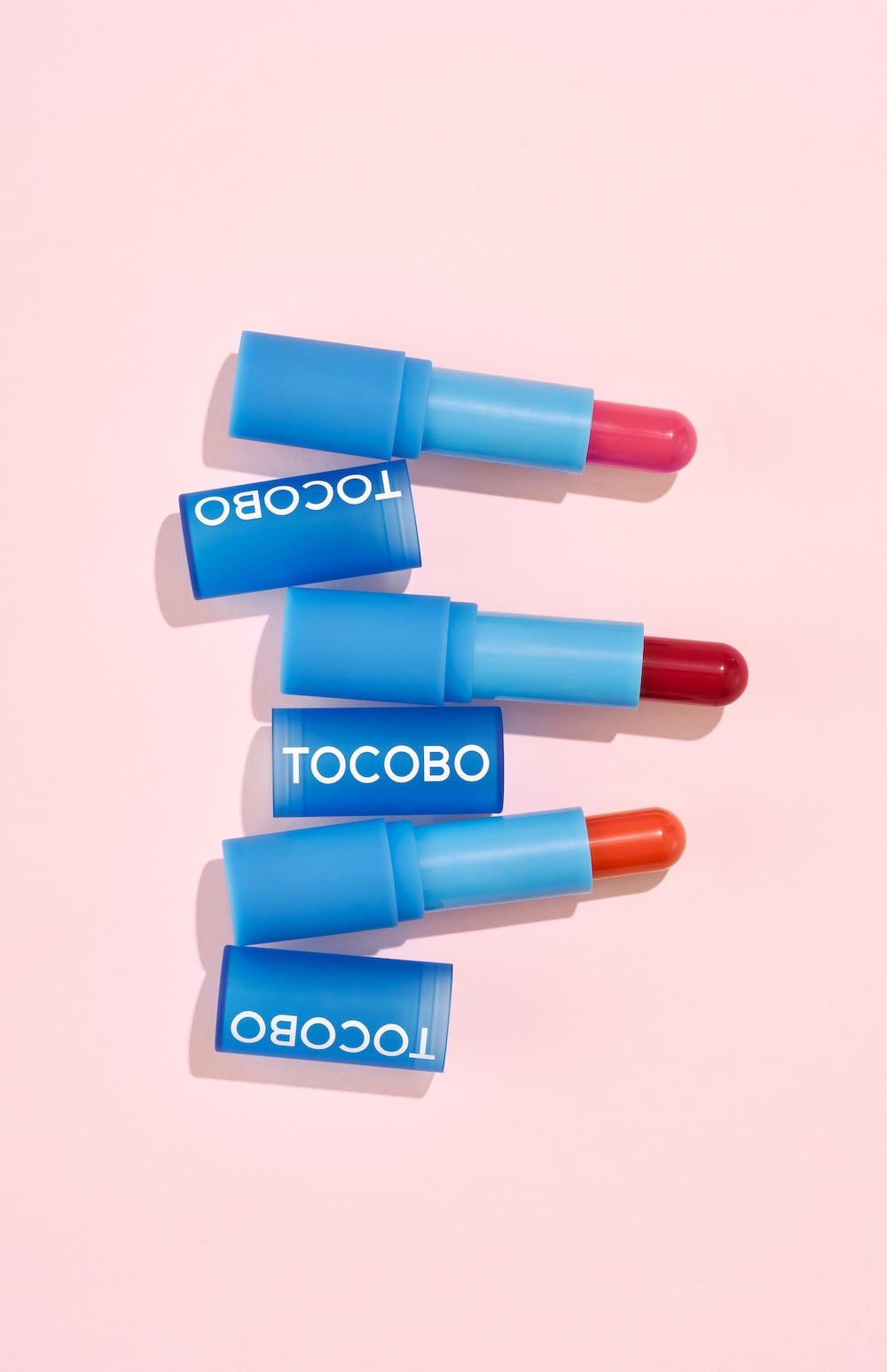 Lip balm tube photographed against neutral background