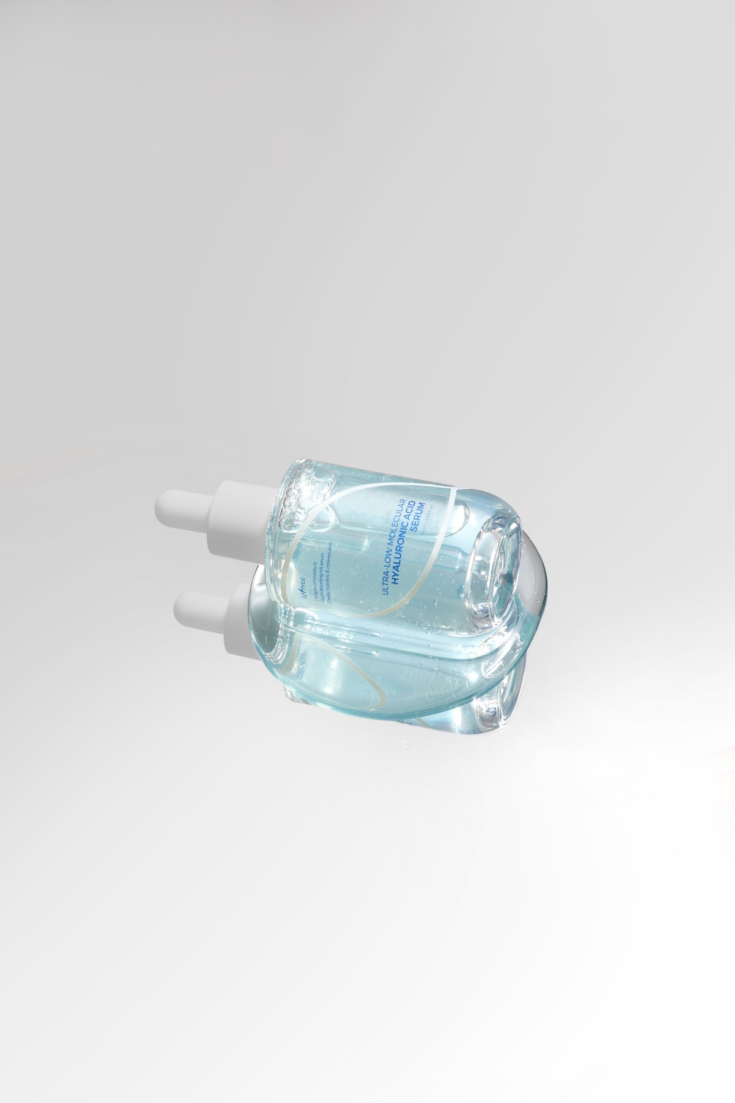 Serum texture stretched between fingers showing bounce