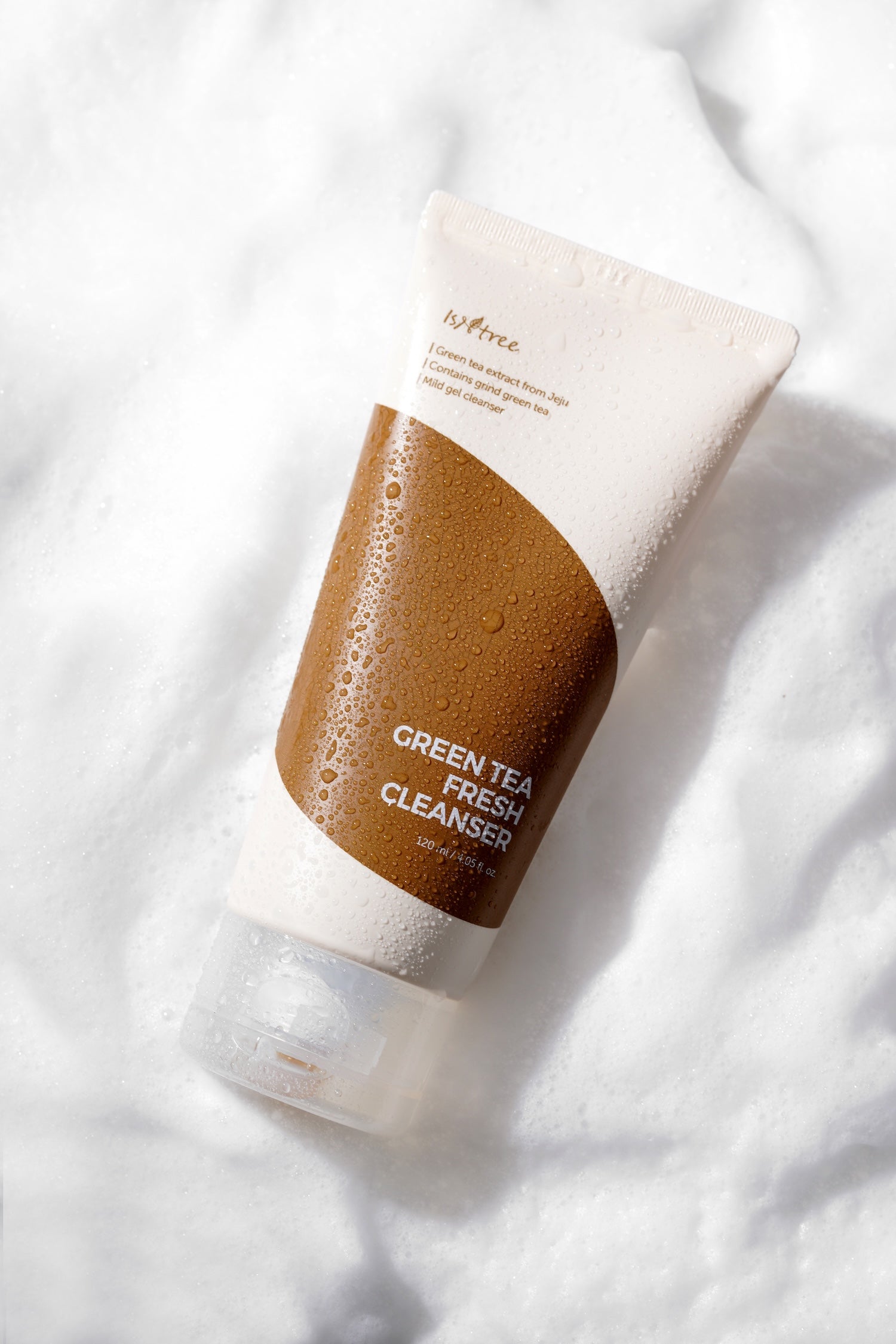 Foam massaged onto face showing fine powder texture